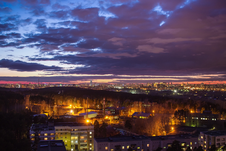 sunset over Yekaterinburg dusk night lights cloudyの写真素材