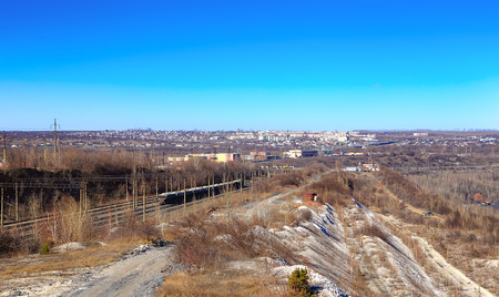 rising from the pit train with  beard against the backdrop of the city of Gubkin awayの写真素材