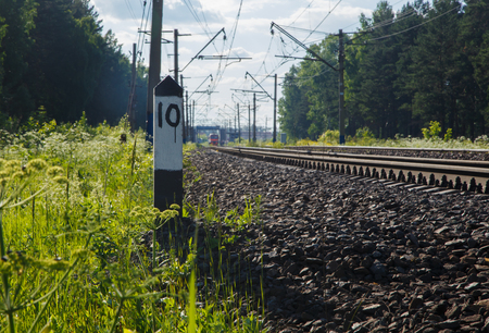 bar at railway tracks on background natural scenery summerの写真素材