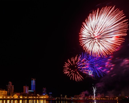 fireworks over night city and city pond Yekaterinburg city center. Celebrating the victory of May 9, 2016の写真素材