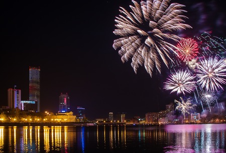 fireworks over night city and city pond Yekaterinburg city center. Celebrating the victory of May 9, 2016の写真素材