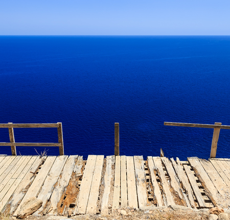 view from a cliff on brusochny broken bridge and sea summer sun Lindosの写真素材