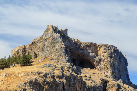 Acropolis of Lindos bottom view of bay of Rhodes Greece summer sunny weather with cloudsの写真素材
