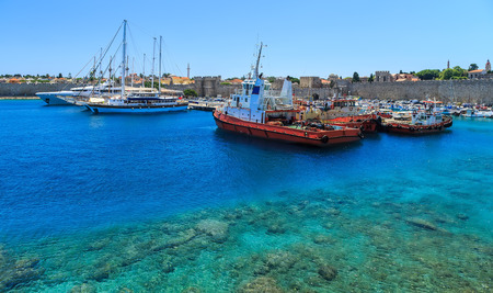 port of Rhodes with views of the ramparts Greece sunny dayの写真素材