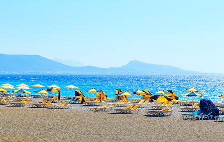 Striped beach umbrella on the beach. europeanの写真素材