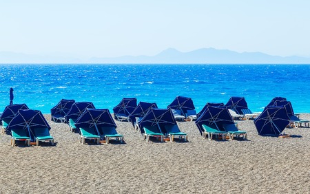 Striped beach umbrella on the beach. europeanの写真素材