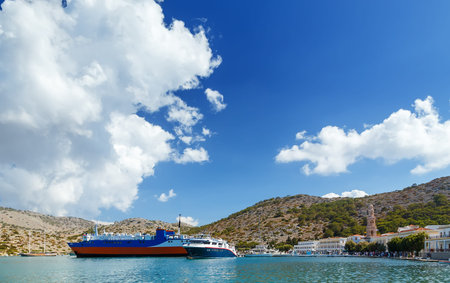 Boats in the harbor of Panormitis. Symi island, Greece.