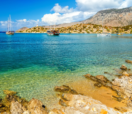 View of beautiful bay in Bay of panormitis of Symi island , the ships. and boats at anchor, Greeceの写真素材