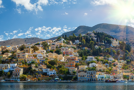 Symi island - Colorful houses and small boats at the heart of the villageの写真素材