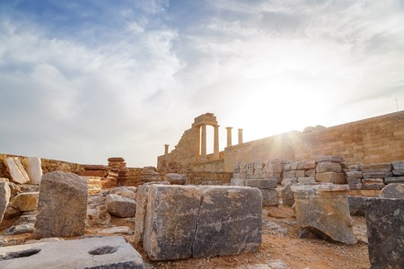 Greece. Rhodes. Acropolis of Lindos. Doric columns  the ancient Temple  Athena Lindia the IV century BC and the bay  St. Paulの写真素材