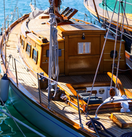 beautiful wooden sailboat docked in port close up. Blurの写真素材