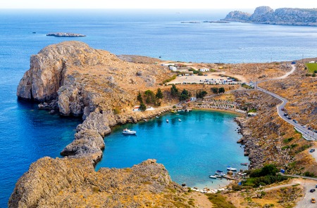 Looking down onto St Pauls Bay at Lindos on Island of Rhodes Greeceの写真素材