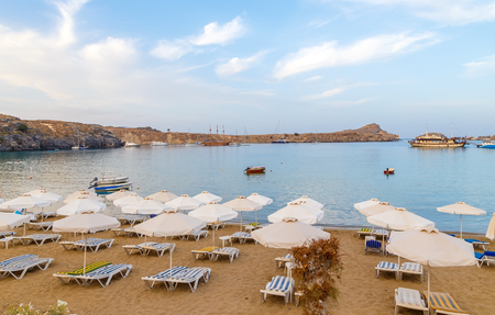 evening view at sunset on stunning beach at Lindos on the Greek Island of Rhodesの写真素材