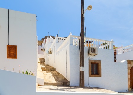 Narrow alley and traditional Greek architecture of Lindos, Rhodes Island, Greeceの写真素材