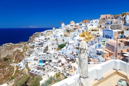 View of the seaside on a summer day. Panorama of Oia village with colorful houses , Santorini island, Greeceの写真素材
