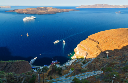the coastline of Oia, Santorini, Cyclades, Greece. view from the hilltop and looking down to Aegean Seaの写真素材