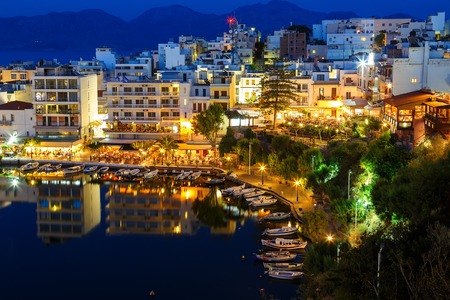 Agios Nikolaos City and Voulismeni Lake at Night Creteの写真素材