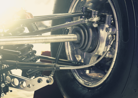 Front wheel of drive car with new tireの写真素材