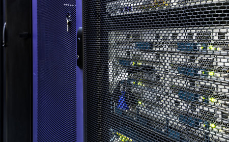 Abstract of modern high tech internet data center room with rows of racks with network and server...