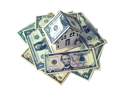 isolate house model on dollar cash stack closeupの写真素材