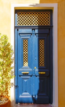 Old doors blue wood with evening soft sunlight of Greek island Creteの写真素材