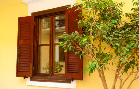 White wall, wooden door and window. Traditional european architecture
