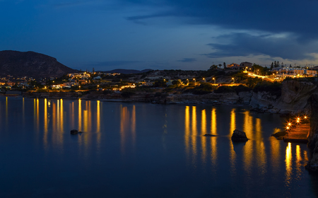 Seafront of Hersonissos in Crete, Greece at nightの写真素材