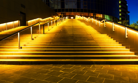 illuminated office building staircase exhaling up to entranceの写真素材