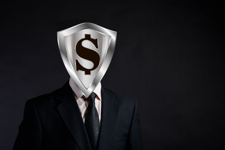 shield with a dollar instead of businessman's head, concept of financial protection and reliability, place for copyspace,の写真素材
