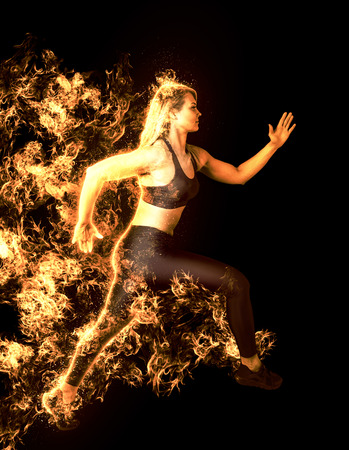 Woman sprinter leaving starting. Fire startの写真素材