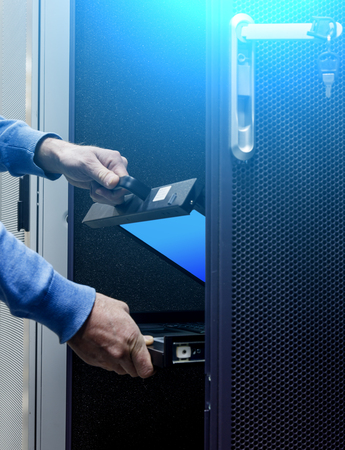hands men folded system monitor server in a modern data centerの写真素材