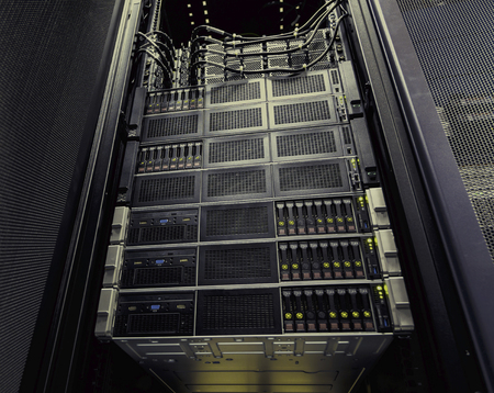 disk storage in a row of supercomputers data center bottom view brown toningの写真素材