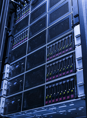 Data center, server room. Blurred background. Blue lights. Blue tone.の写真素材