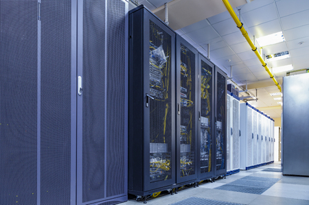 Server internet datacenter room with rows of modern mainframes. Server control center for internet provider.の写真素材