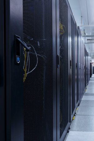 Long corridor in server room with rows of hardware in big data center. Technical equipment and...