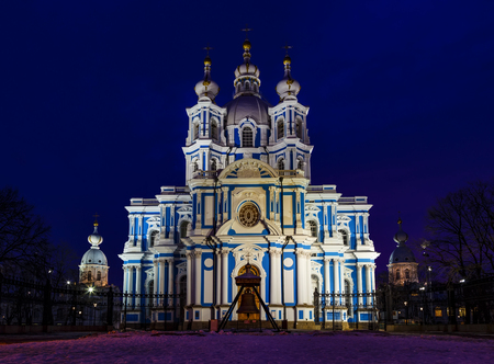 Close up facade of Smolny Cathedral under illumination, Saint Petersburg, Russia. Deep winter night. Dark sky background. Travel destinations conceptの写真素材