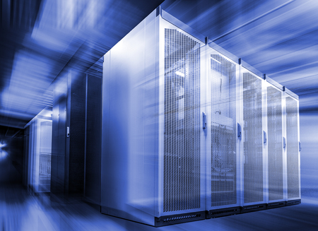 Corridor in large working data center full of rack servers and supercomputers with blur and motion graphics design. Technology related 3D renderingの写真素材