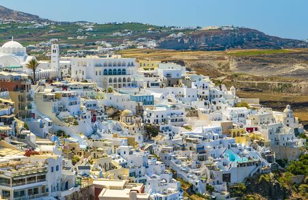 top view of Fira city architecture, mountains and buildings in the background of Santorini, Greeceの写真素材