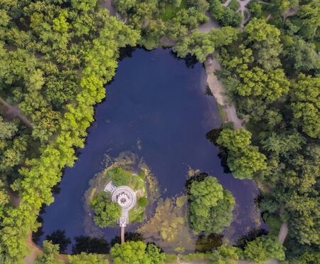 Aerial view pond in park at summer sunny day. Stock. Top view of city Park on the pondの写真素材