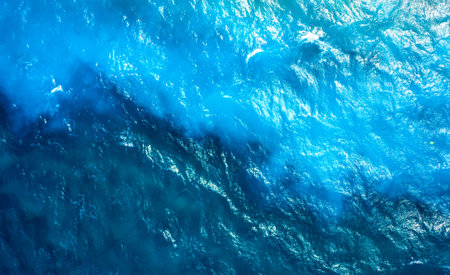 texture of the sea surface with ripples and different shades of turquoise. waves of the turquoise...