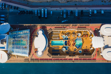 top view of the cruise ship pool close-up. sunbeds, pool and people relax in the sun