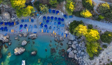 Aerial birds eye view drone photo Anthony Quinn near Ladiko bay on Rhodes island, Dodecanese, Greece. Panorama with nice lagoon and clear blue water. Famous tourist destination in South Europe.の写真素材