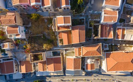 Aerial bird's eye view photo taken by drone of iconic castle of Symi in Ano chora with views to port of Symi island, Dodecanese, Greeceの写真素材