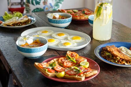 simple healthy food on an old wooden table, serving with simple dishes, natural lemonade.の写真素材