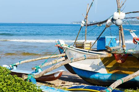 fishing boat Galle Sri Lanka close up on ocean shoreの写真素材