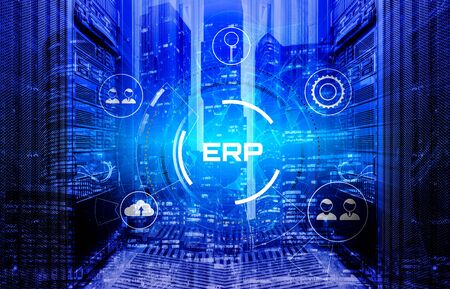 night business buildings of the city center double exposure on the background of mainframes of the data center, a hologram of the erp system in the foreground. Concept of managing businesses and large corporations using softwareの写真素材