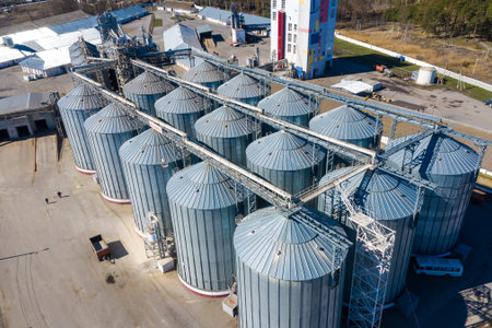 Aerial view of drone on a large granary . Large aluminum containers for storing loose grain