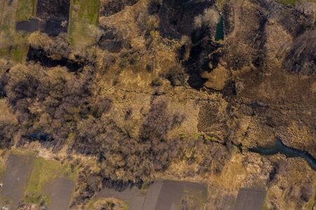 Aerial view from drone of summer landscape with river, hills and forests.の写真素材