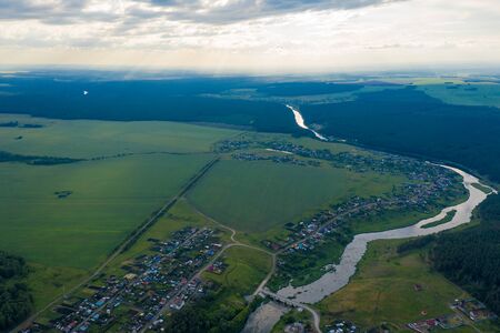 flying on drone over an evening picturesque valley with stormy streams and rapids of Iset river, tourist places to travel. Ural, Russiaの写真素材