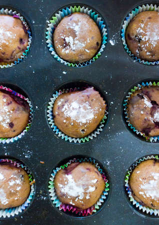 Carrot muffins in metal baking form. Homemade tasty dessert or breakfast. Healthy eating concept. Top viewの写真素材